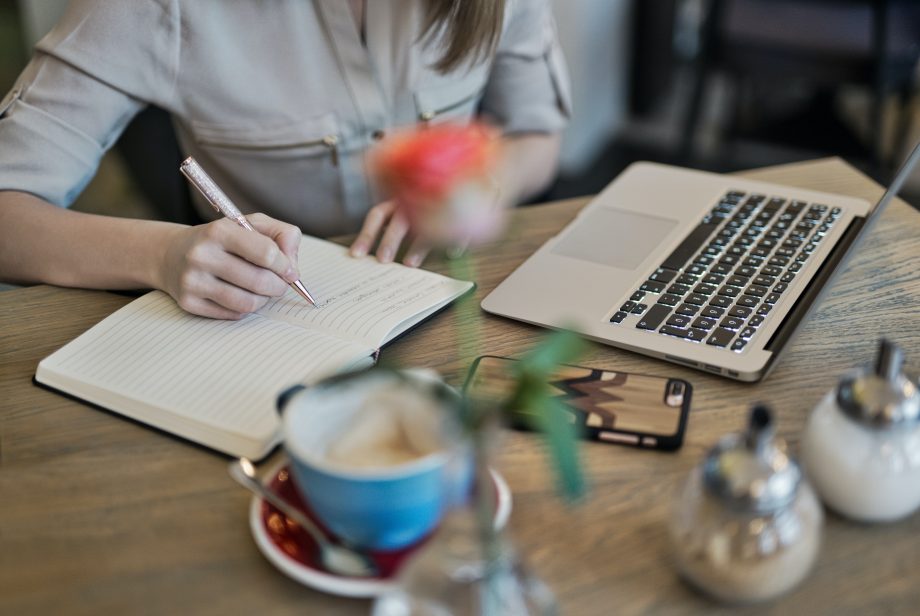 Woman at desk content planning in her notebook